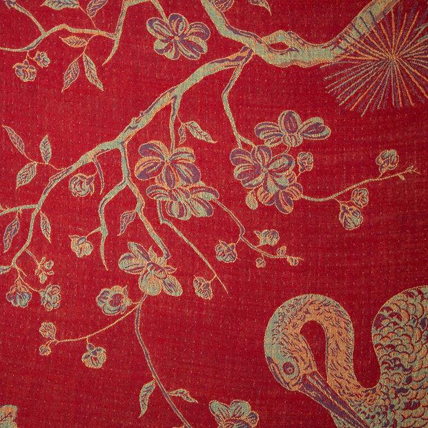 red fabric with sunning flowers and birds