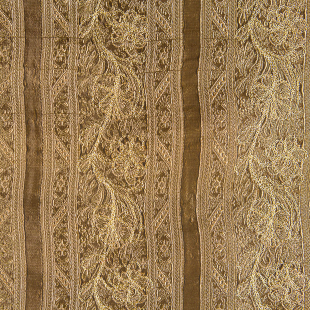Gold fabric with flower motive. 