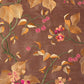 Brown silk fabric with colorful embroidery . 